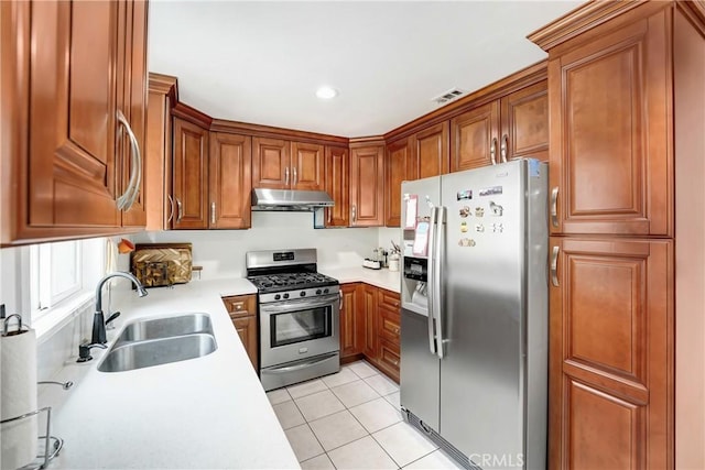 137 N Viceroy Ave, Azusa, CA 91702 - kitchen featuring stainless steel appliances, extractor fan, light countertops, light tile patterned floors, and brown cabinetry