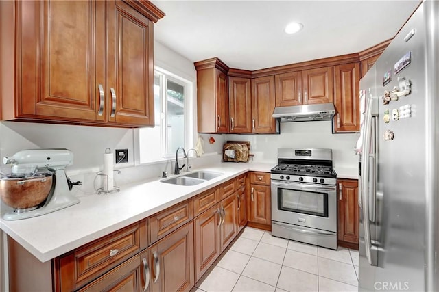 137 N Viceroy Ave, Azusa, CA 91702 - kitchen featuring appliances with stainless steel finishes, under cabinet range hood, brown cabinets, light countertops, and light tile patterned floors