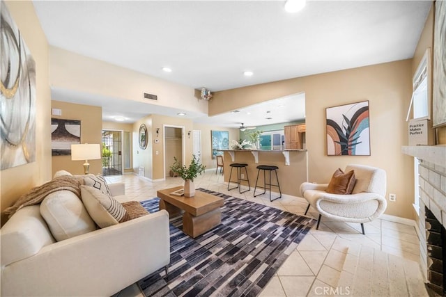 6910 Valinda Ave, Rancho Cucamonga, CA 91701 - living room with light tile patterned flooring, a fireplace, and recessed lighting
