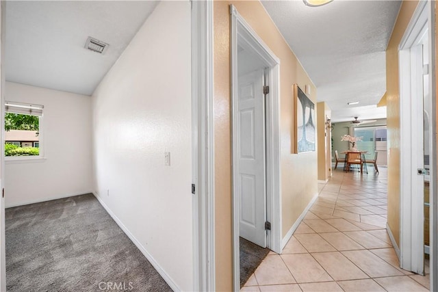 6910 Valinda Ave, Rancho Cucamonga, CA 91701 - hall with light tile patterned floors and baseboards