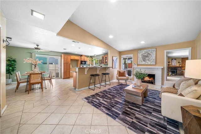6910 Valinda Ave, Rancho Cucamonga, CA 91701 - living room with light tile patterned flooring, healthy amount of natural light, a brick fireplace, a ceiling fan, and recessed lighting