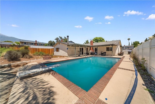 6910 Valinda Ave, Rancho Cucamonga, CA 91701 - view of swimming pool with a fenced backyard and a patio