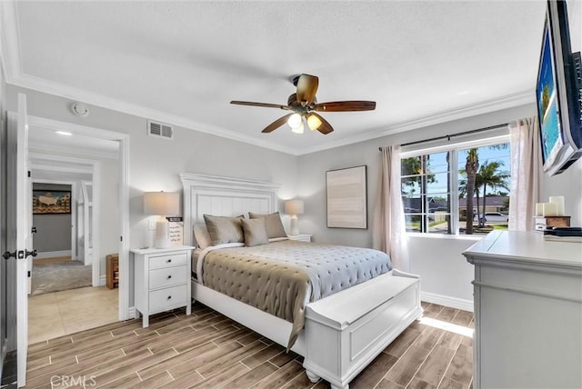 2622 S Pacific Ave, Santa Ana, CA 92704 - bedroom featuring wood tiled floors, crown molding, and ceiling fan