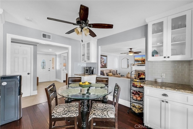 2622 S Pacific Ave, Santa Ana, CA 92704 - dining space featuring a ceiling fan and dark wood-style floors