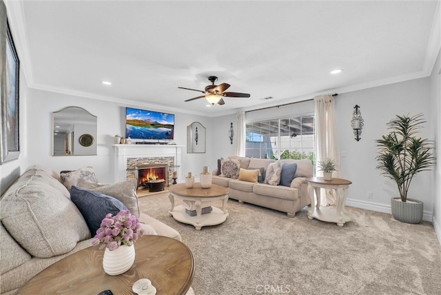 2622 S Pacific Ave, Santa Ana, CA 92704 - carpeted living area with ornamental molding, a fireplace, ceiling fan, and recessed lighting
