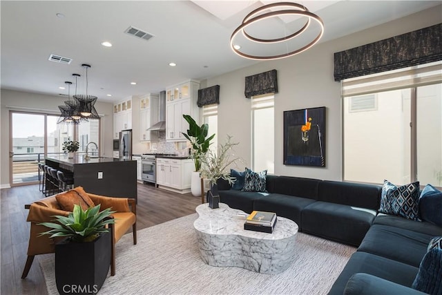 35 Ebb Tide Cir, Newport Beach, CA 92663 - living room with dark wood-style flooring and recessed lighting