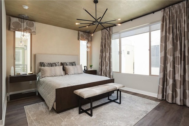 35 Ebb Tide Cir, Newport Beach, CA 92663 - bedroom with multiple windows, wood finished floors, and a chandelier