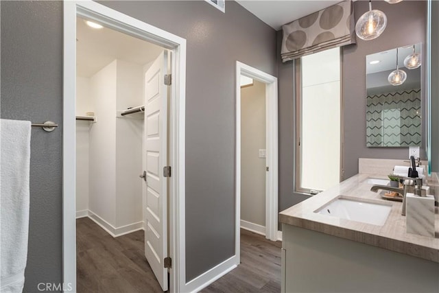 35 Ebb Tide Cir, Newport Beach, CA 92663 - full bathroom featuring wood finished floors, vanity, and a spacious closet