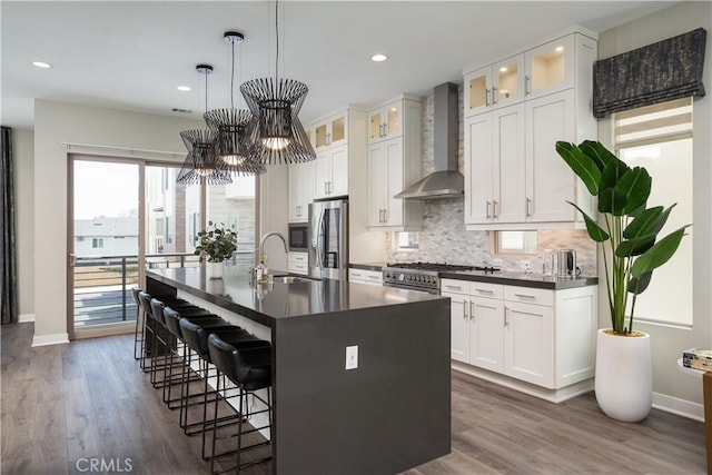35 Ebb Tide Cir, Newport Beach, CA 92663 - kitchen with wall chimney exhaust hood, dark countertops, backsplash, dark wood-type flooring, and recessed lighting