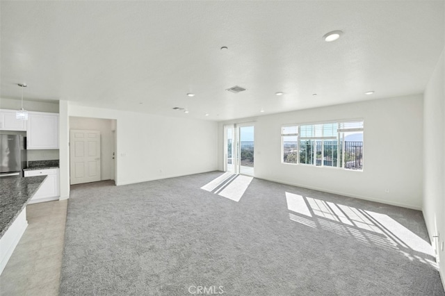 41207 Alegria Ln, Lake Elsinore, CA 92532 - unfurnished living room featuring light carpet and recessed lighting