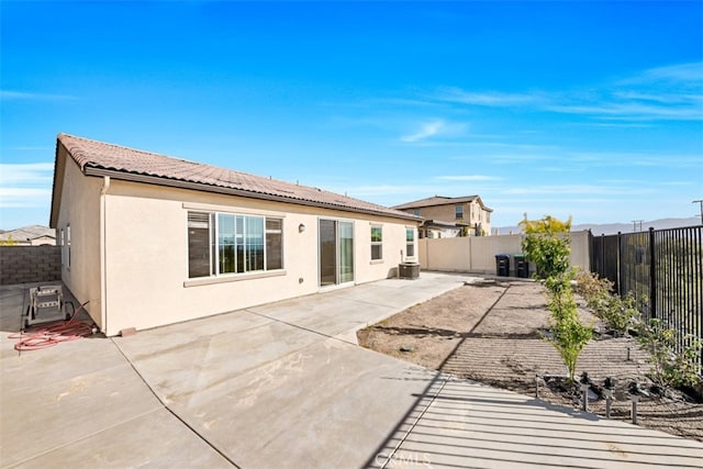 41207 Alegria Ln, Lake Elsinore, CA 92532 - rear view of house featuring a fenced backyard, a patio area, and stucco siding