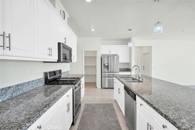41207 Alegria Ln, Lake Elsinore, CA 92532 - kitchen featuring stainless steel appliances, white cabinets, dark stone counters, decorative light fixtures, and recessed lighting