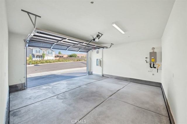 41207 Alegria Ln, Lake Elsinore, CA 92532 - garage featuring tankless water heater and a garage door opener