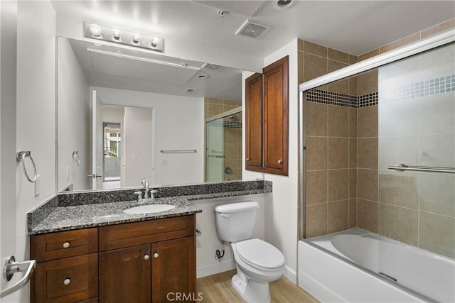 1106 Scholarship, Irvine, CA 92612 - full bathroom featuring vanity, bath / shower combo with glass door, and wood finished floors