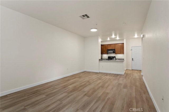 1106 Scholarship, Irvine, CA 92612 - unfurnished living room featuring light wood-style flooring and baseboards