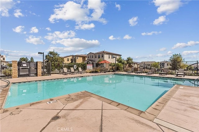 2825 Villa Catalonia Ct, Corona, CA 92881 - community pool featuring a patio area and a residential view