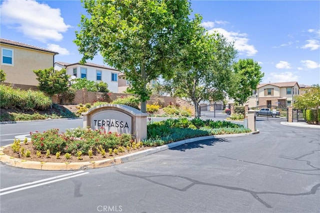 2825 Villa Catalonia Ct, Corona, CA 92881 - community sign with a residential view and a gate
