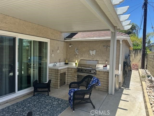 3110 N Greenbrier Rd, Long Beach, CA 90808 - view of patio with area for grilling