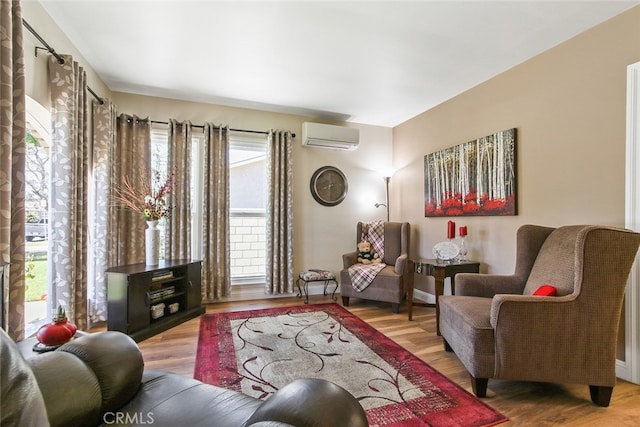 3110 N Greenbrier Rd, Long Beach, CA 90808 - living area featuring an AC wall unit and wood finished floors