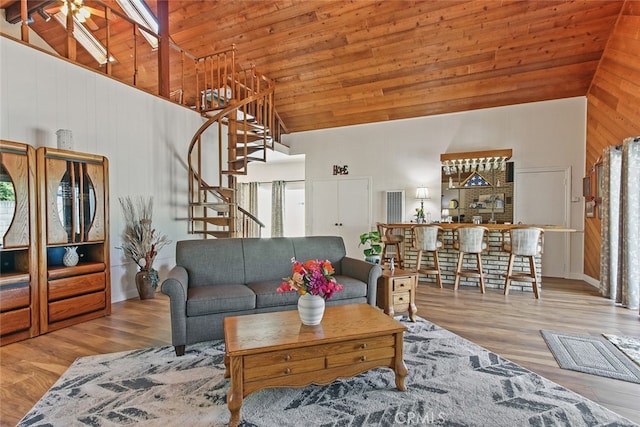 3110 N Greenbrier Rd, Long Beach, CA 90808 - living room with high vaulted ceiling, stairs, wood finished floors, wood walls, and wooden ceiling
