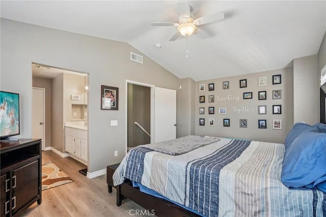 1519 Bluejay Way, Hemet, CA 92545 - bedroom featuring light wood-style floors, vaulted ceiling, connected bathroom, and a ceiling fan