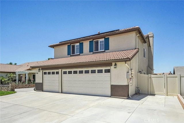 1519 Bluejay Way, Hemet, CA 92545 - mediterranean / spanish-style home featuring stucco siding, concrete driveway, a gate, a garage, and a tiled roof