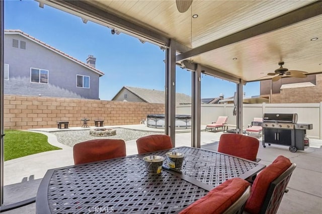 1519 Bluejay Way, Hemet, CA 92545 - fenced backyard featuring outdoor dining area, a ceiling fan, and area for grilling