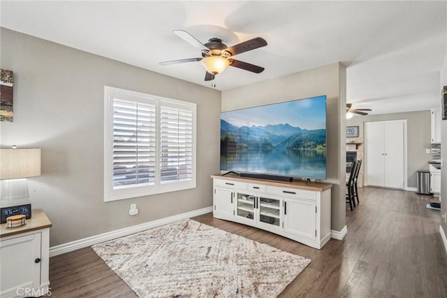 1519 Bluejay Way, Hemet, CA 92545 - living room with ceiling fan and dark wood-style flooring