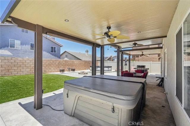 1519 Bluejay Way, Hemet, CA 92545 - fenced backyard with a hot tub, a patio area, and a ceiling fan