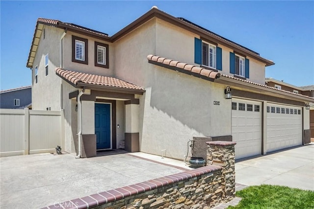 1519 Bluejay Way, Hemet, CA 92545 - mediterranean / spanish house with an attached garage, concrete driveway, stucco siding, and a tile roof