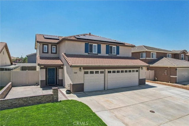 1519 Bluejay Way, Hemet, CA 92545 - mediterranean / spanish-style home featuring concrete driveway, a garage, stucco siding, roof mounted solar panels, and a tile roof