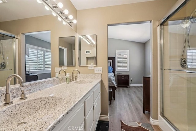 1519 Bluejay Way, Hemet, CA 92545 - full bathroom featuring ensuite bath, double vanity, a shower with shower door, wood finished floors, and lofted ceiling