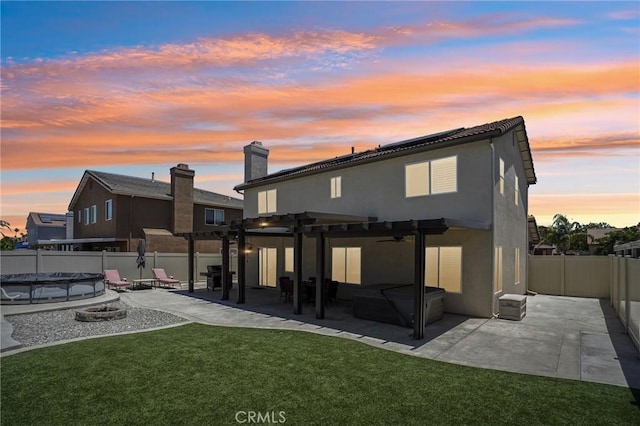 1519 Bluejay Way, Hemet, CA 92545 - back of property featuring ceiling fan, a fenced backyard, a pergola, a patio, and stucco siding