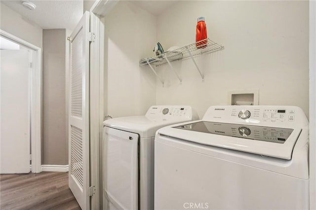 1519 Bluejay Way, Hemet, CA 92545 - laundry area with separate washer and dryer and wood finished floors