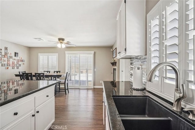 1519 Bluejay Way, Hemet, CA 92545 - kitchen featuring ceiling fan, dark wood finished floors, white cabinets, and dark stone countertops