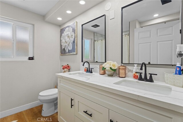 1443 E Devonshire Ave, Hemet, CA 92544 - full bathroom featuring double vanity, wood finished floors, and recessed lighting