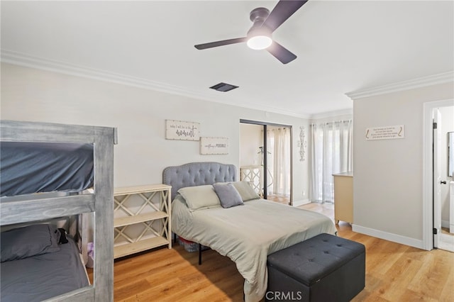 1443 E Devonshire Ave, Hemet, CA 92544 - bedroom with crown molding, light wood-type flooring, and ceiling fan