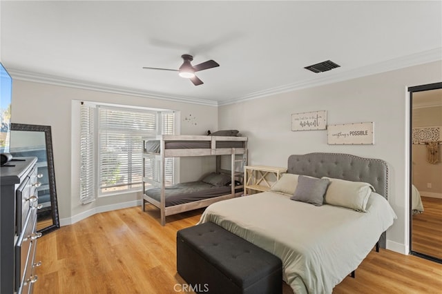 1443 E Devonshire Ave, Hemet, CA 92544 - bedroom with crown molding, light wood-style flooring, and a ceiling fan