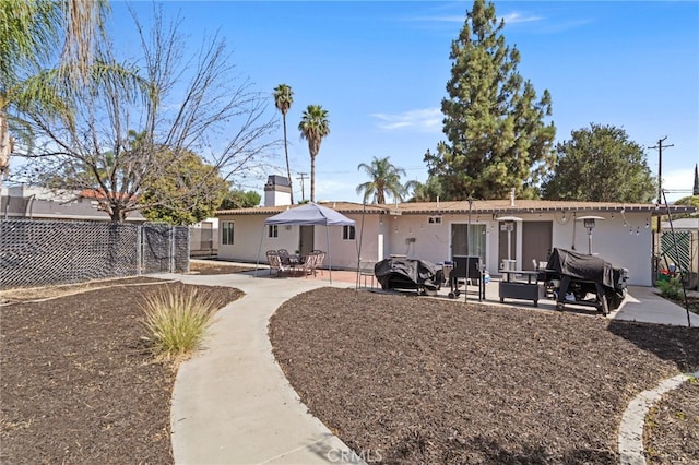 1443 E Devonshire Ave, Hemet, CA 92544 - back of house featuring a patio and stucco siding
