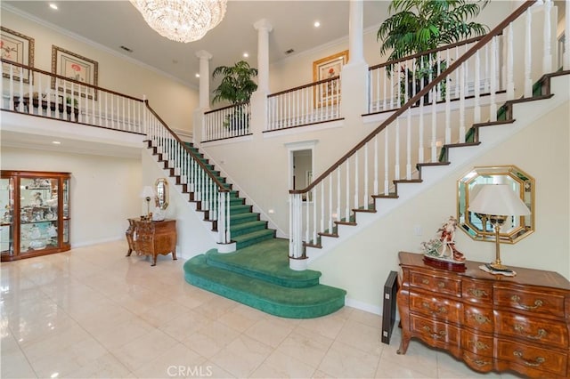 2809 Oak Knoll Dr, Diamond Bar, CA 91765 - staircase with decorative columns, a towering ceiling, ornamental molding, a chandelier, and recessed lighting