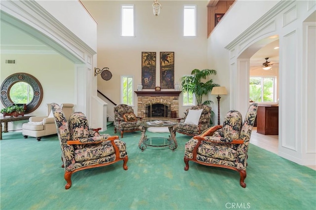 2809 Oak Knoll Dr, Diamond Bar, CA 91765 - carpeted living room featuring plenty of natural light, a fireplace, ceiling fan, a towering ceiling, and ornamental molding
