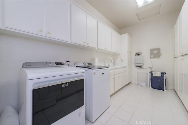 2809 Oak Knoll Dr, Diamond Bar, CA 91765 - laundry area with independent washer and dryer, attic access, cabinet space, and light tile patterned flooring