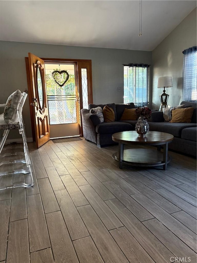 1140 W Cubbon St, Santa Ana, CA 92703 - living room with vaulted ceiling and wood finished floors
