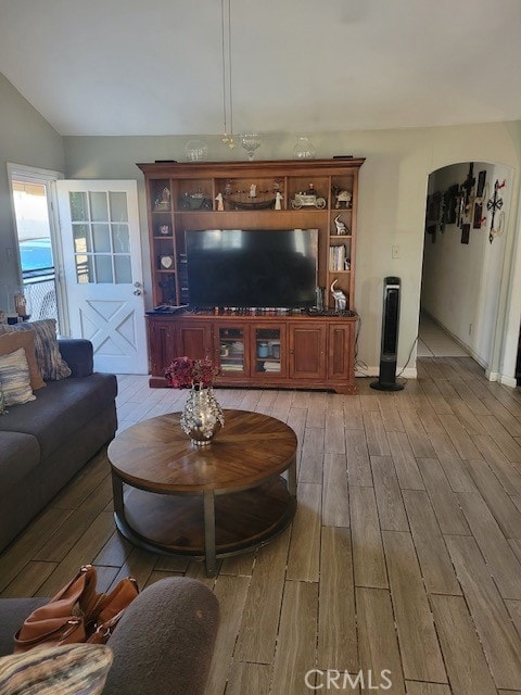 1140 W Cubbon St, Santa Ana, CA 92703 - living room with light wood-style flooring and lofted ceiling