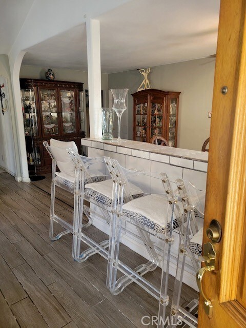 1140 W Cubbon St, Santa Ana, CA 92703 - dining space featuring wood finished floors and arched walkways