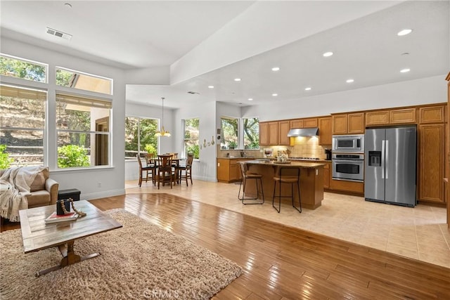 12703 Paso Verde Ct, Atascadero, CA 93422 - living room with healthy amount of natural light, light wood-type flooring, and recessed lighting