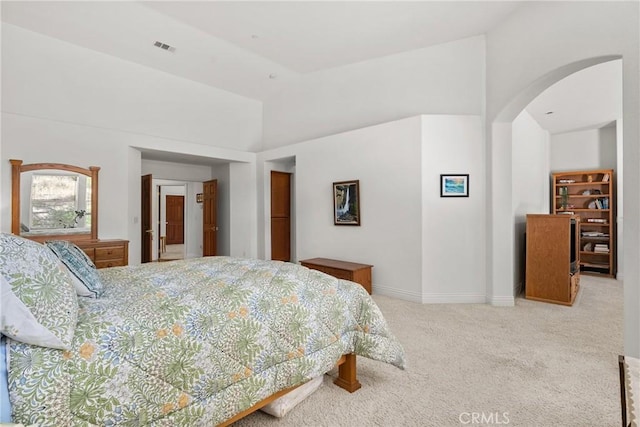 12703 Paso Verde Ct, Atascadero, CA 93422 - carpeted bedroom featuring arched walkways and a high ceiling