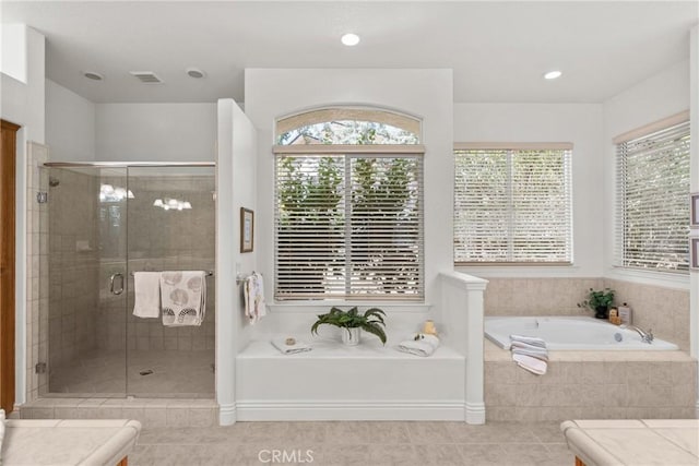 12703 Paso Verde Ct, Atascadero, CA 93422 - full bathroom featuring healthy amount of natural light, a bath, tile patterned flooring, a stall shower, and recessed lighting