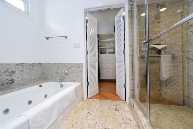 4161 Dixie Canyon Ave, Sherman Oaks, CA 91423 - full bathroom featuring a stall shower, a jetted tub, and a closet
