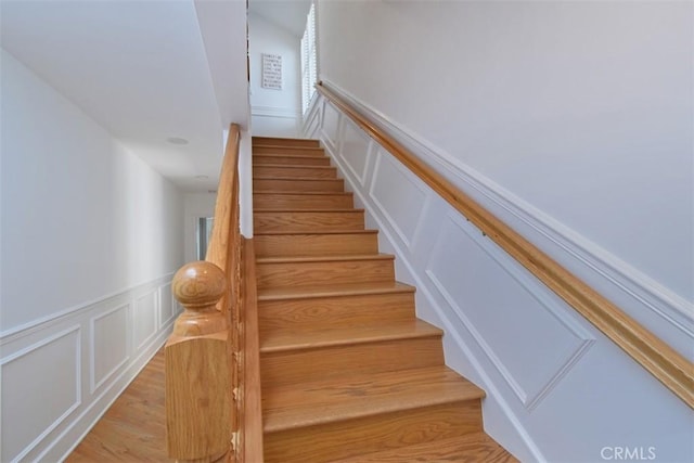4161 Dixie Canyon Ave, Sherman Oaks, CA 91423 - staircase featuring a decorative wall, wainscoting, and wood finished floors
